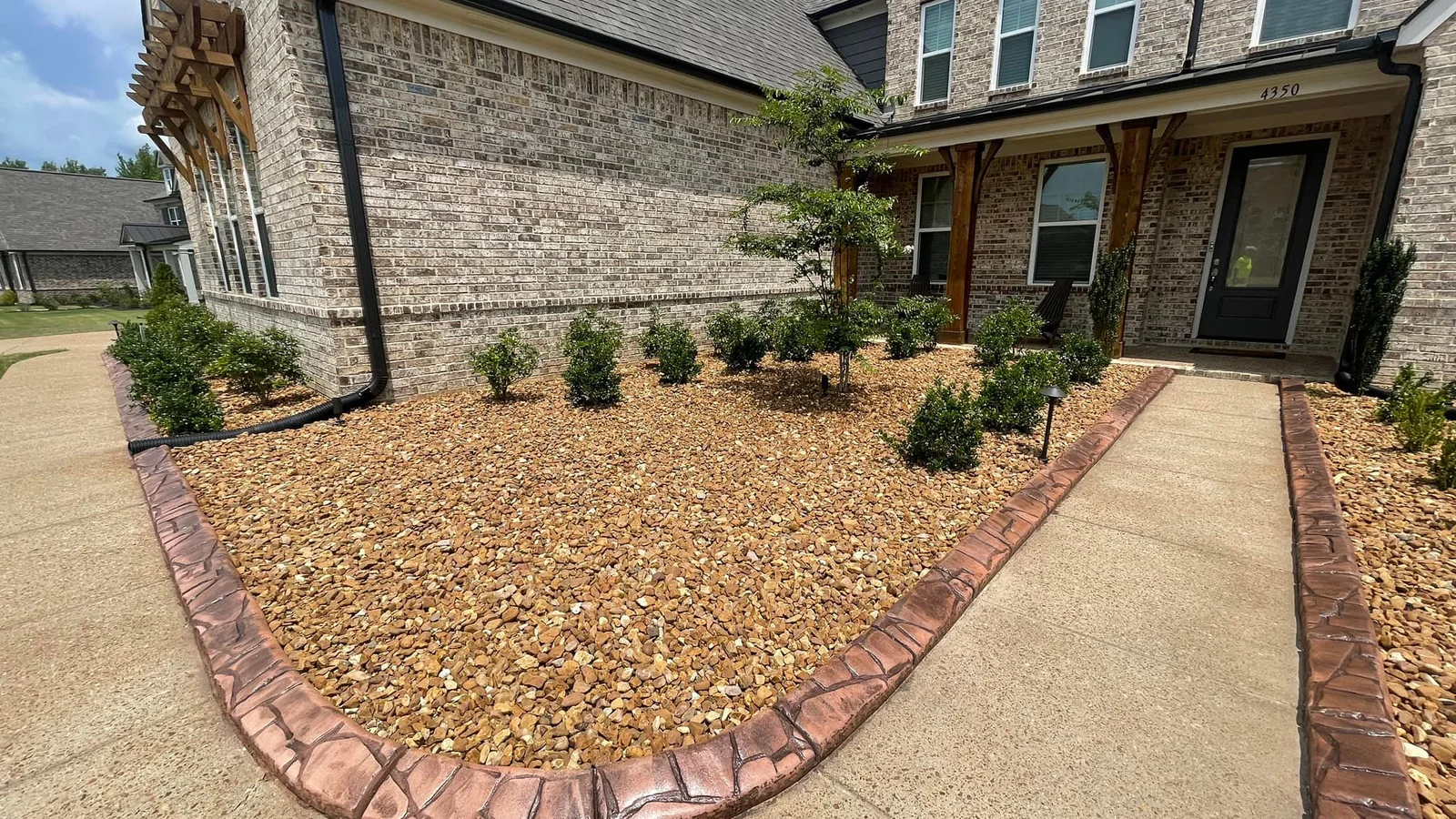 Decorative concrete curbing and landscape website hero image